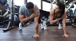 Toning Bingo Wings: Your Ultimate Guide to Sculpting Sleek Arms at the Gym 3 Fitness trainer demonstrating arm toning exercises Livingston
