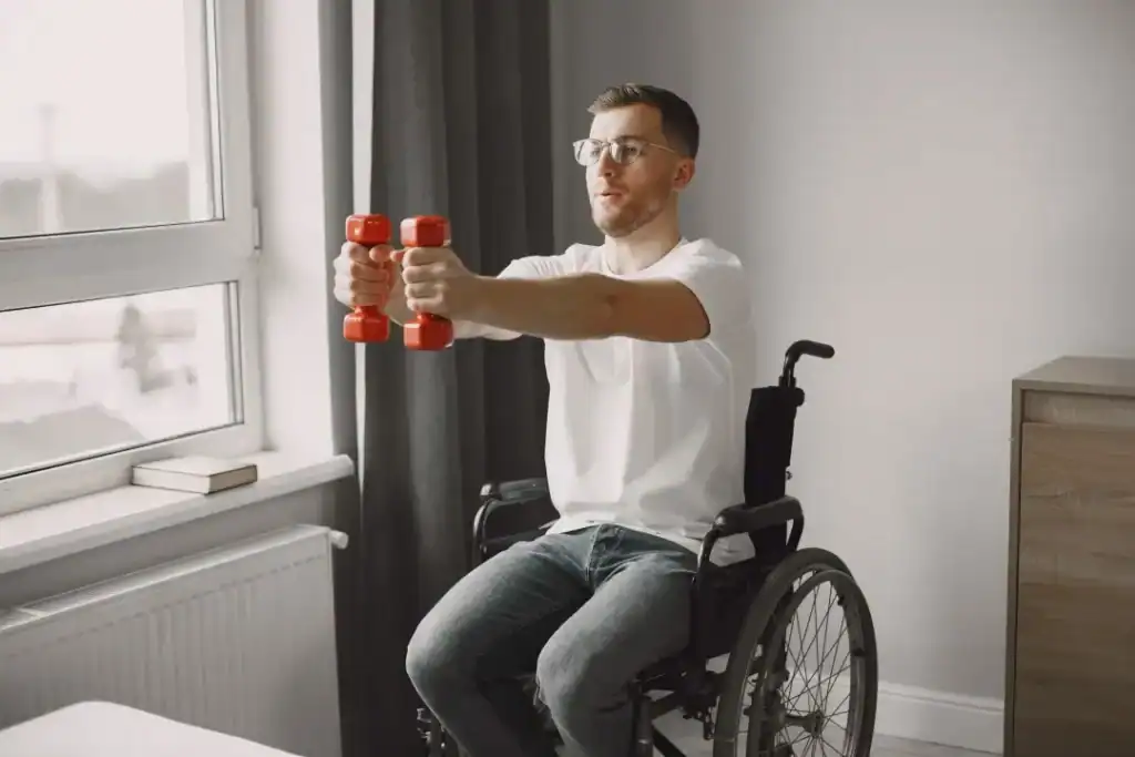 Image of man doing exercise in his wheelchair to aid weight loss Livingston