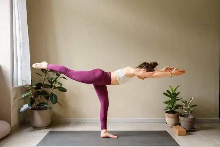 Woman doing Yoga exercise Livingston to help with toning the body. 
