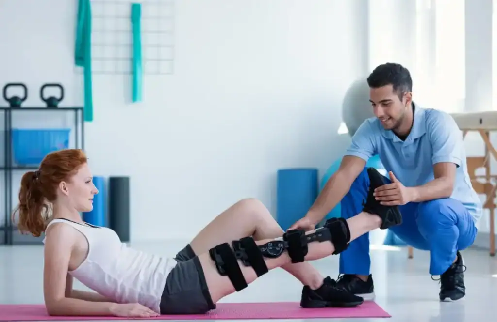 Woman having treatment to help muscle recovery Livingston after an injury