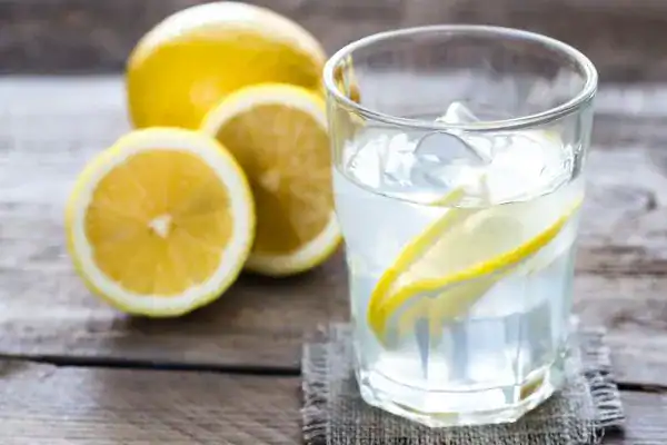 Hydration: The Secret Ingredient for a Toned Stomach and Enhanced Fitness 2 Image of lemon water to aid hydration Livingston